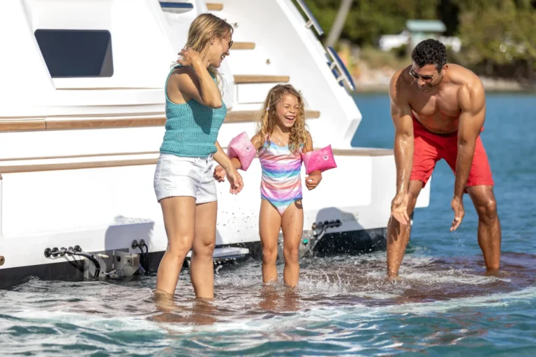 Princess X65 family playing on swim platform