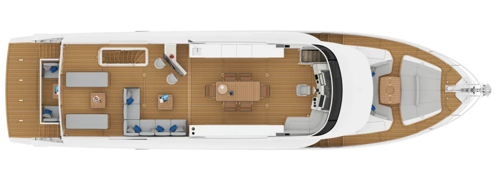 Top-down view of a luxury motor yacht deck showing a teak-floored social area, dining table, galley, and helm forward.
