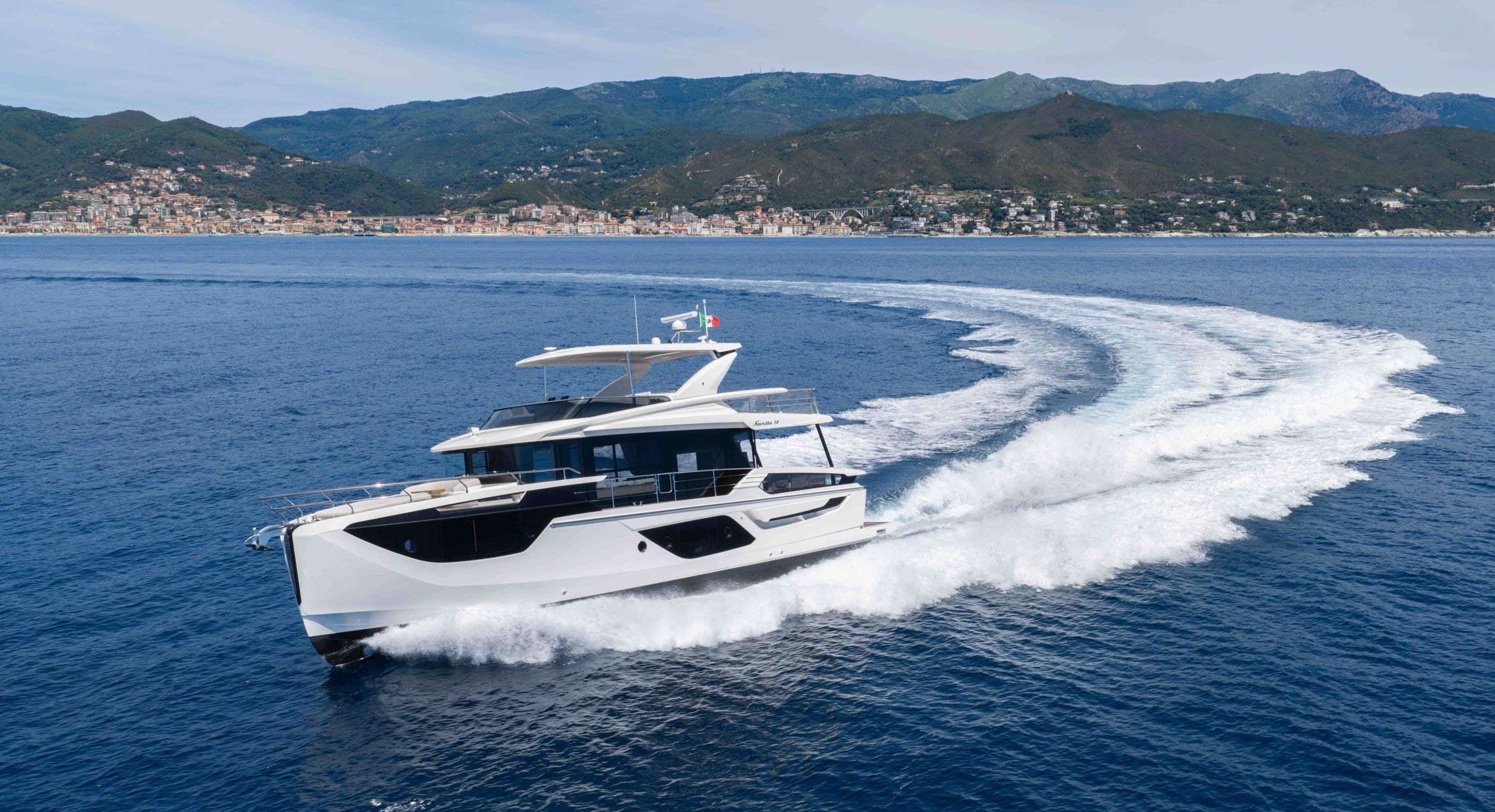 absolute yachts navetta 58 cruising in the ocean near mountains