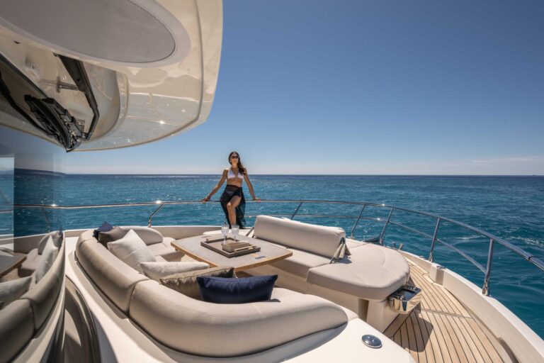 woman looking at the ocean from the bow of navetta 58