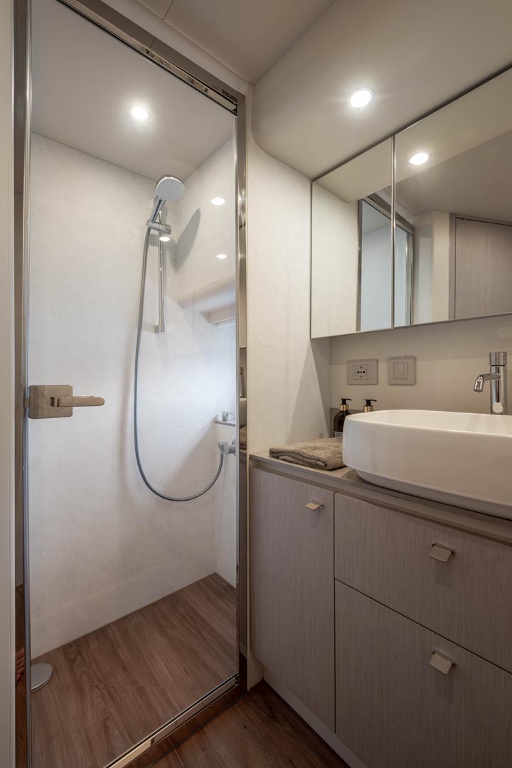 guest bathroom with shower stall and sink in navetta 50