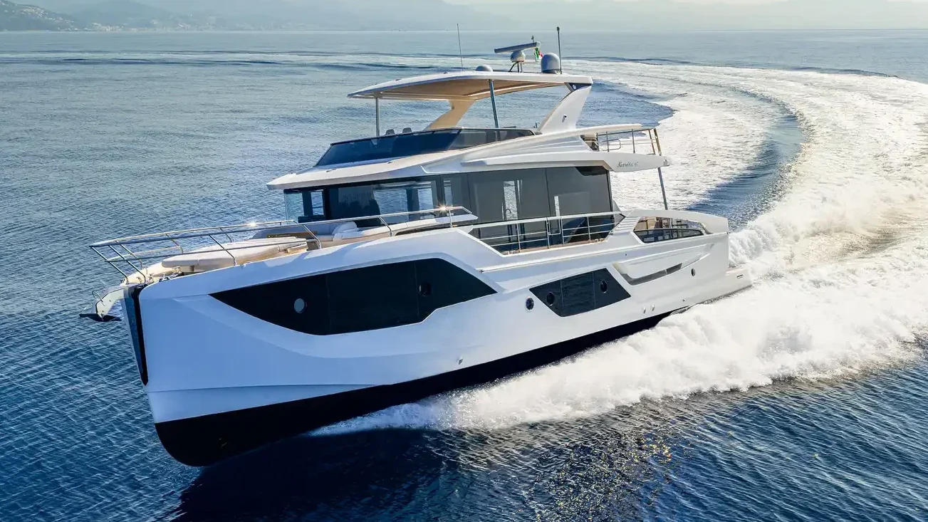 absolute yachts exterior on full cruising speed with spacious deck areas and large windows